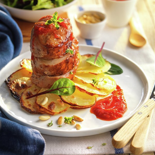 Cochinillo asado con costra de hierbas y frutos secos