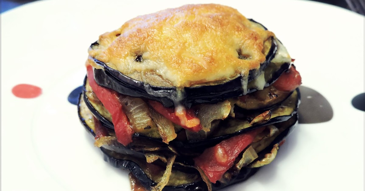Timbal de berenjena con pimientos y cebolla
