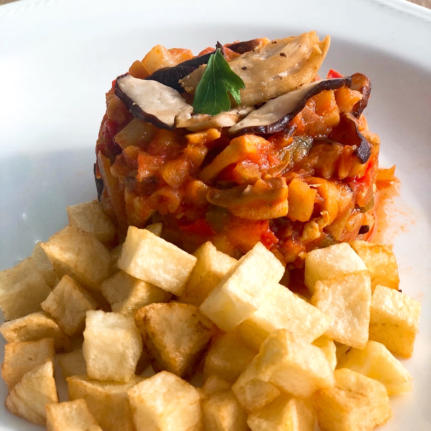 Timbal de berenjena con pollo y curry